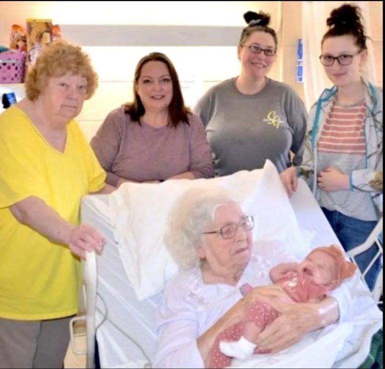 A 98-year-old woman is pictured alongside six generations of her family